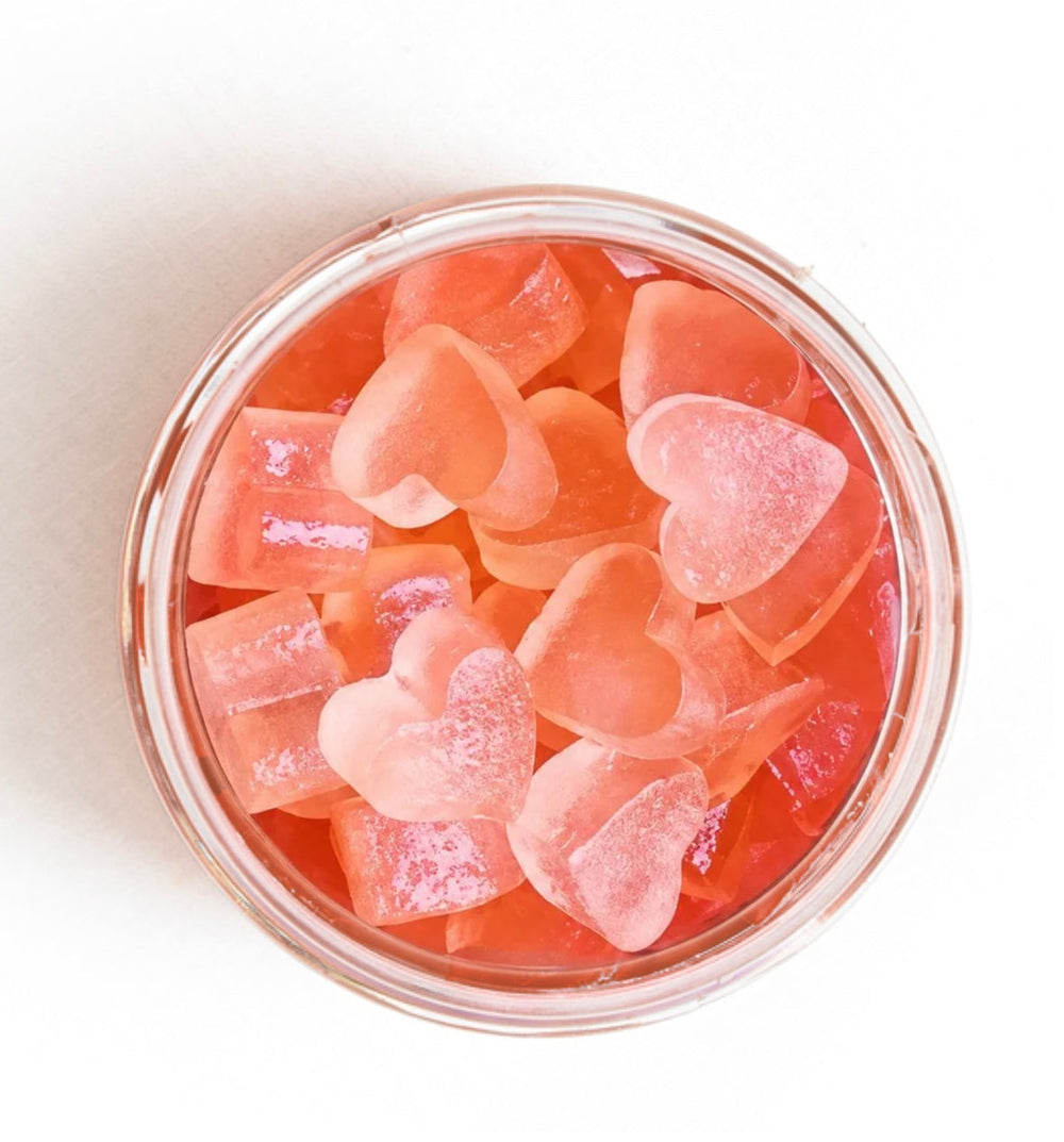 Looking into an open jar of Rose Yummies, smooth heart-shaped gummies